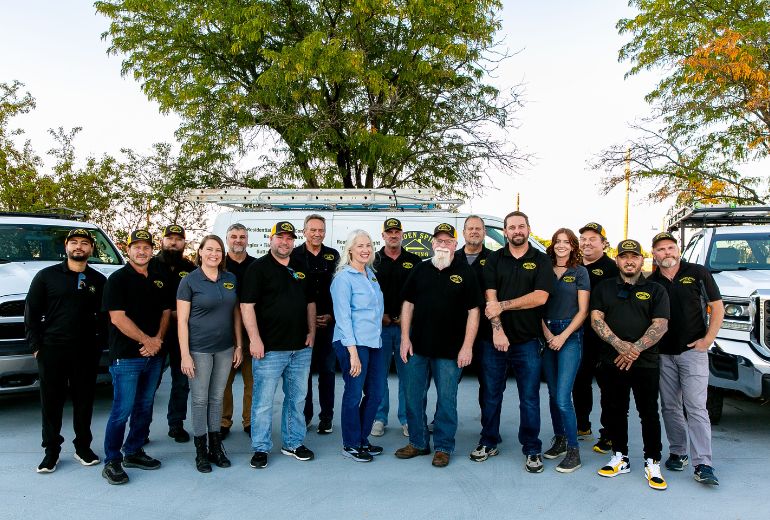 The Golden Spike Roofing team standing confidently, ready to deliver top-quality roofing solutions.
